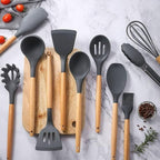 Non-stick safe silicone cooking utensils with wooden handles and stand